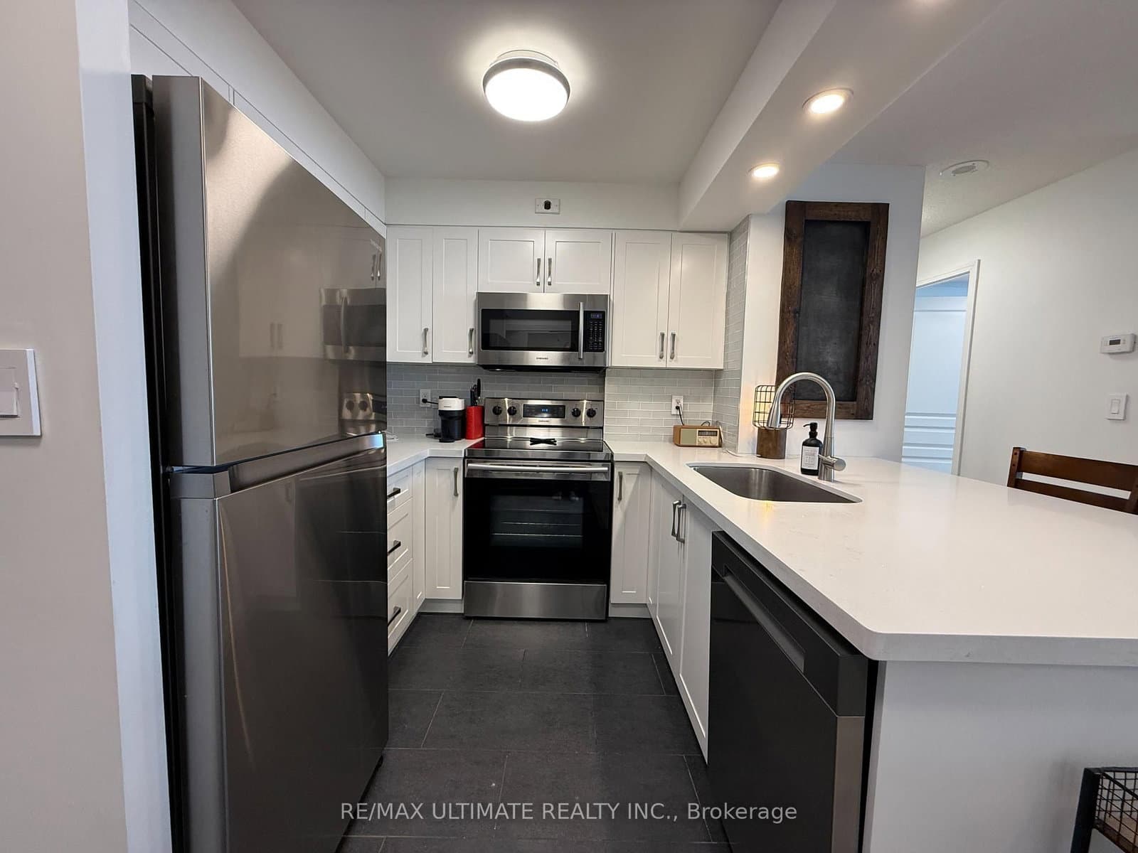 #312 - 1765 Queen Street E